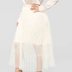 Not Meshing With Her Embroidered Skirt